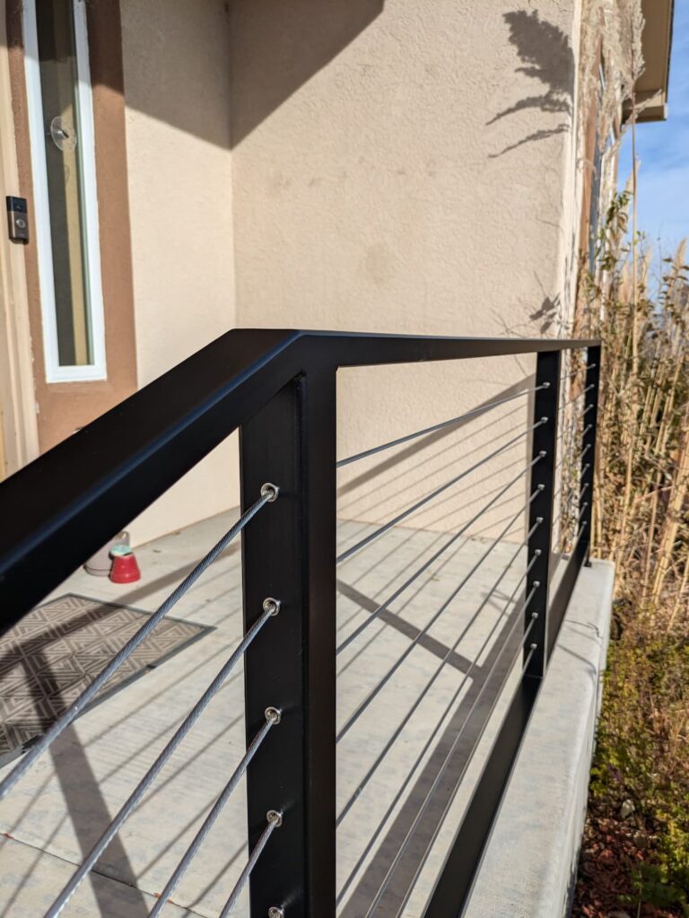 Railing with stainless steel cable infill.
